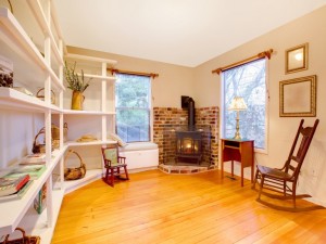 Living room in a cute country garden house with fire stove