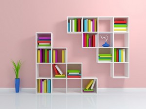 White bookshelf with a colorful books.