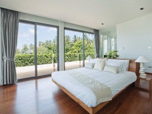 Panoramic view of nice cozy  bedroom  with tropical outdoor