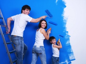 Young family painting the wall
