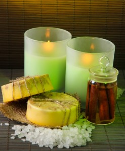 Hand made soap and candles on bamboo mat background