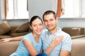 Young happy smiling attractive couple at home