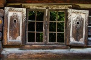 Decorative window of wooden cabin