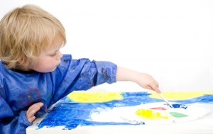 Painting with blue poster paint