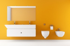 modern bathroom with orange wall and white equipment
