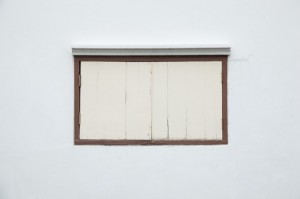 Old window on a white wall.